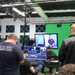 Neurodivergent creators working on digital media projects, collaborating, and learning skills at JDS Creative Academy in an inclusive, supportive environment.