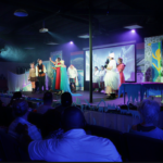 JDS Creative Academy students performing on stage during a community showcase and digital media production class